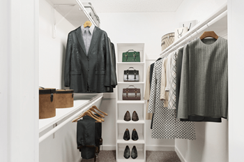 Virtually staged walk in closet with hanged clothes, shelves, shoes and handbags